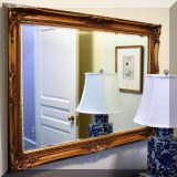 DM02. Gold framed beveled glass mirror .30”h x 42”w 